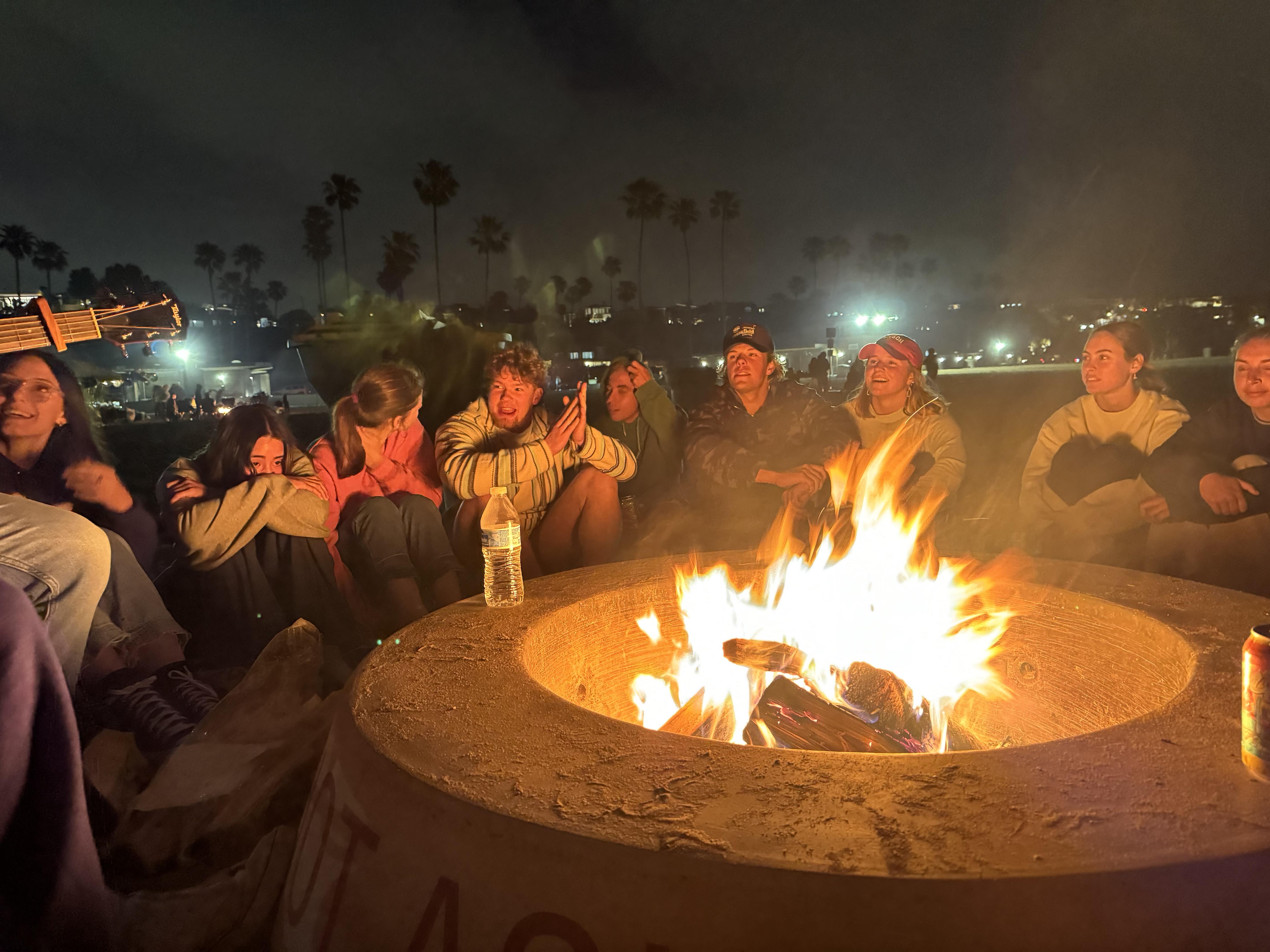 Students enjoy a nighttime fire pit at ABS worship night